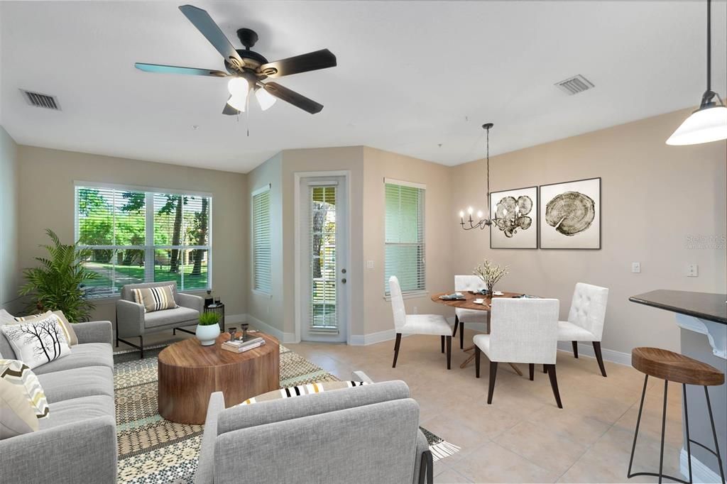 This photo has been virtually staged. Adjacent to the living room is a covered lanai, providing a tranquil space with courtyard views, perfect for relaxation.