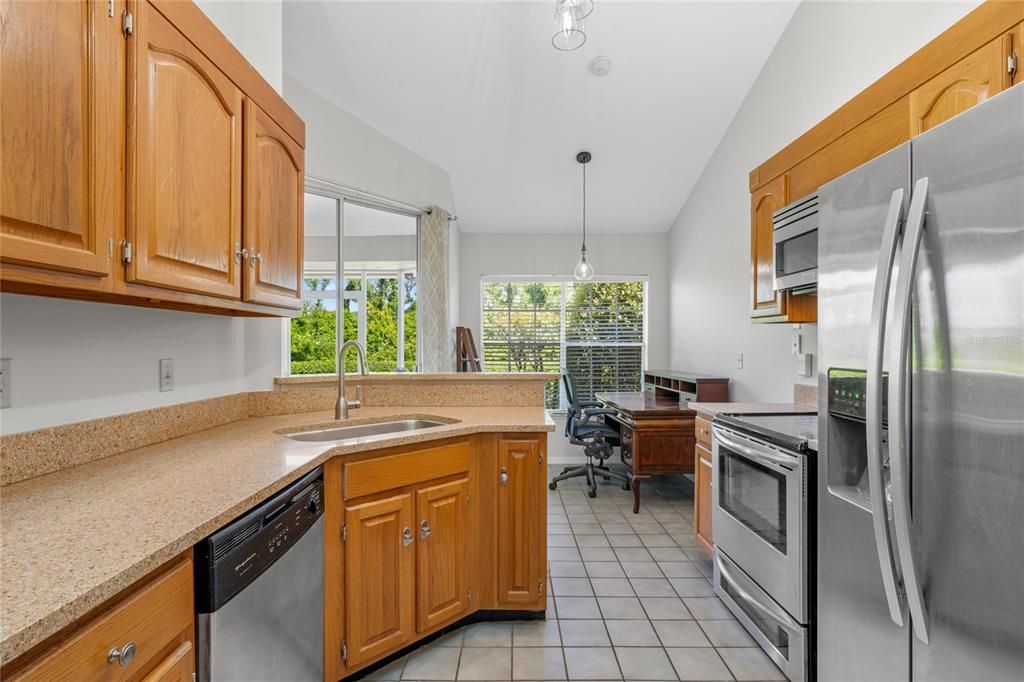 Kitchen with granite counter tops and stainless steel appliances