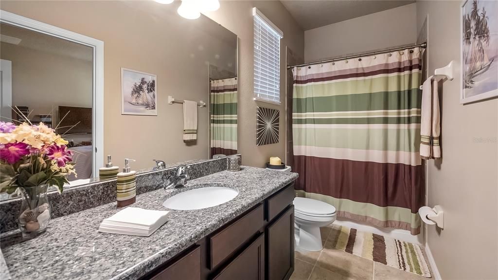 Bathroom three, granite, tub/shower combo and pool bath