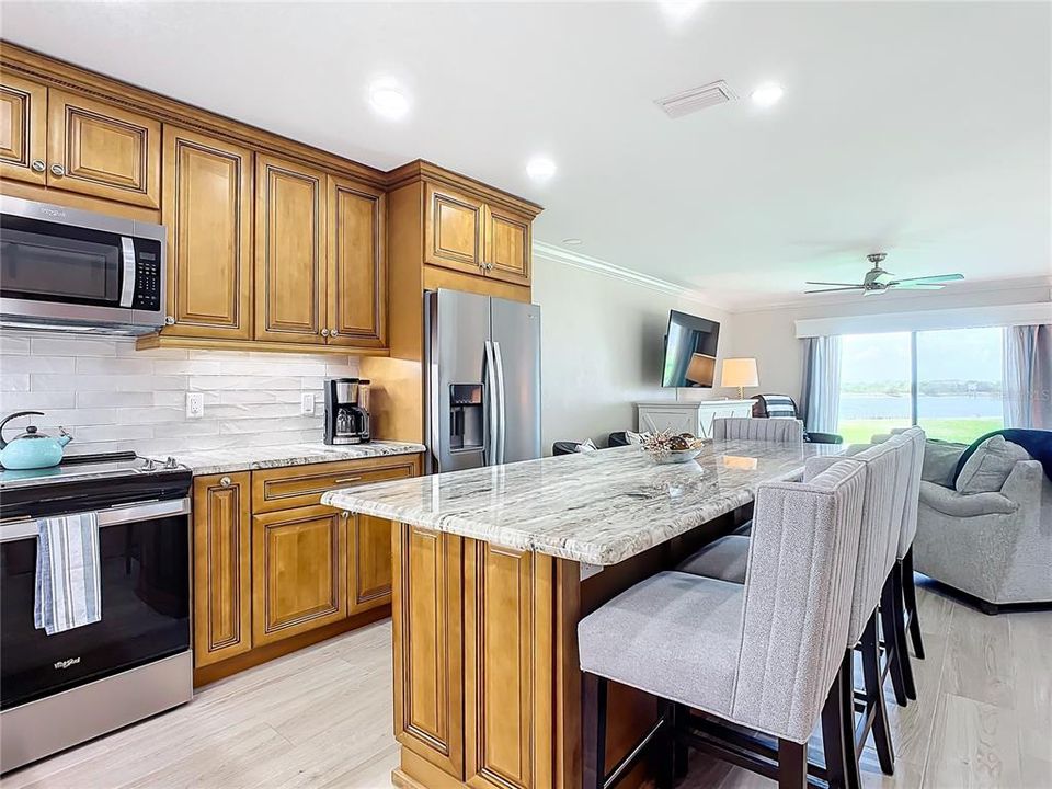 Large kitchen features island with seating for 8!