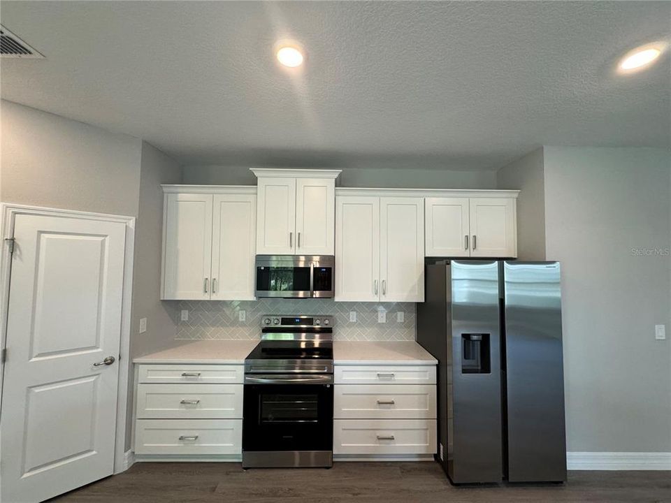 Kitchen Fridge wall with Drawer Base Cabinets