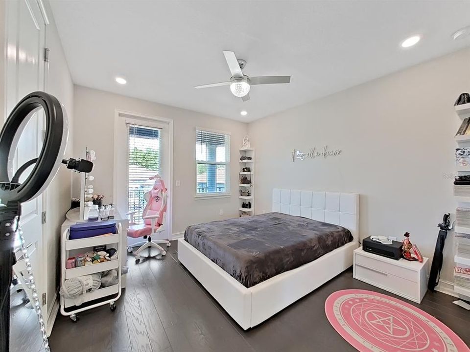 Spacious bedrooms with door leading out to the front balcony perfect for getting fresh air, reading, or studying.