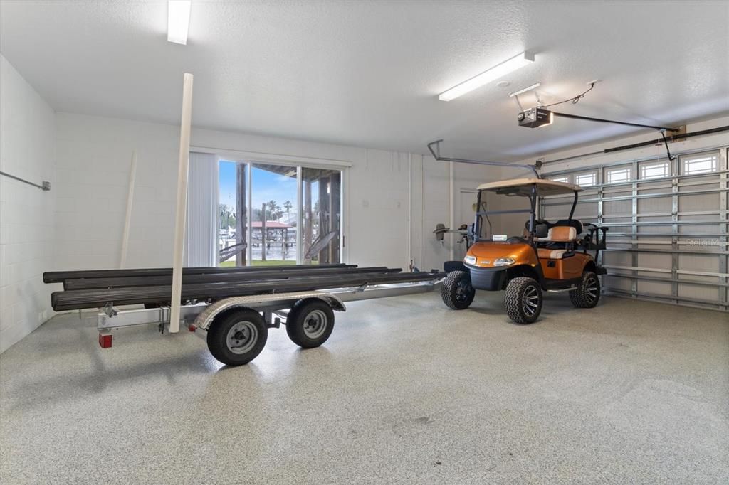 Golf cart and boat trailer included! Large garage for lots of toys
