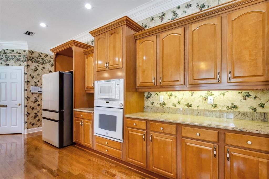 Solid wood cabinetry surrounds this kitchen.