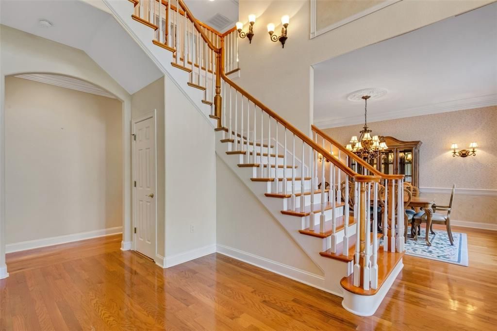 Flanking the staircase to one side is a spacious formal dining room