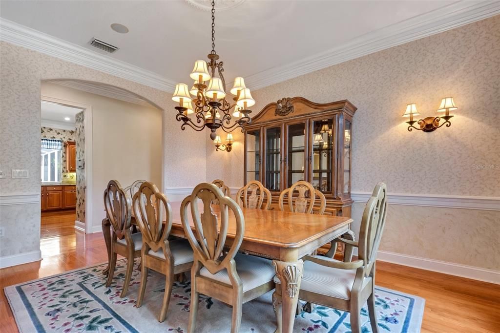 A view from the formal dining room into the kitchen.