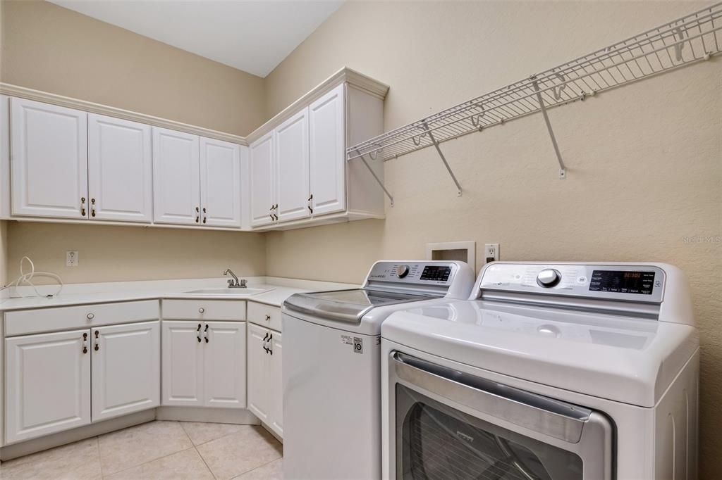 Still on the main floor just off the hall way is a great laundry room, with plenty of storage.
