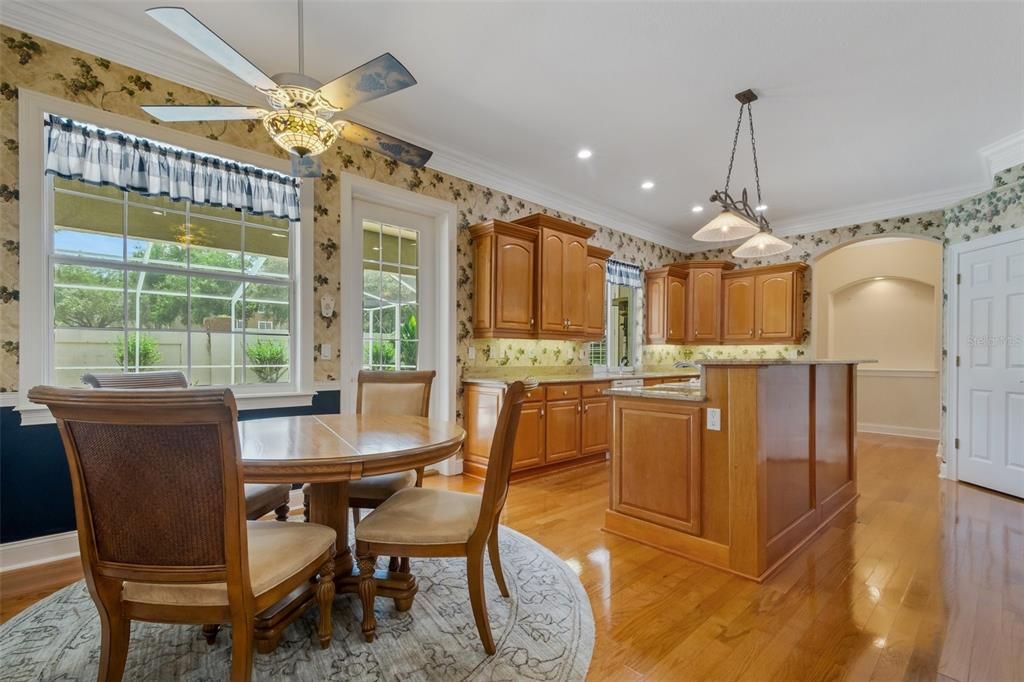 The kitchen features a walk-in pantry, cook-top, wall oven/s newer refrigerator, dishwasher, microwave ,disposal, along with solid wood cabinetry and granite countertops, the island also has a prep sink and great storage as well.