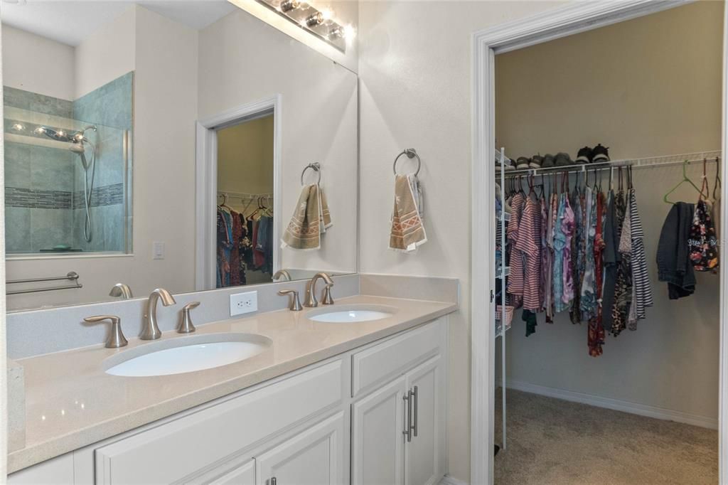 Dual sink vanity and walk-in closet