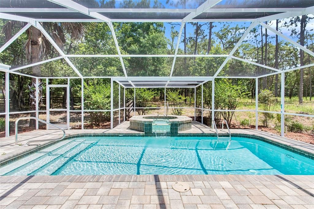 Heated pool and jacuzzi create your year-round oasis. Perfect for relaxation or splashing fun!