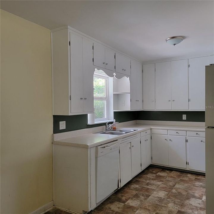 KITCHEN WINDOW OVERLOOKING BACKYARD