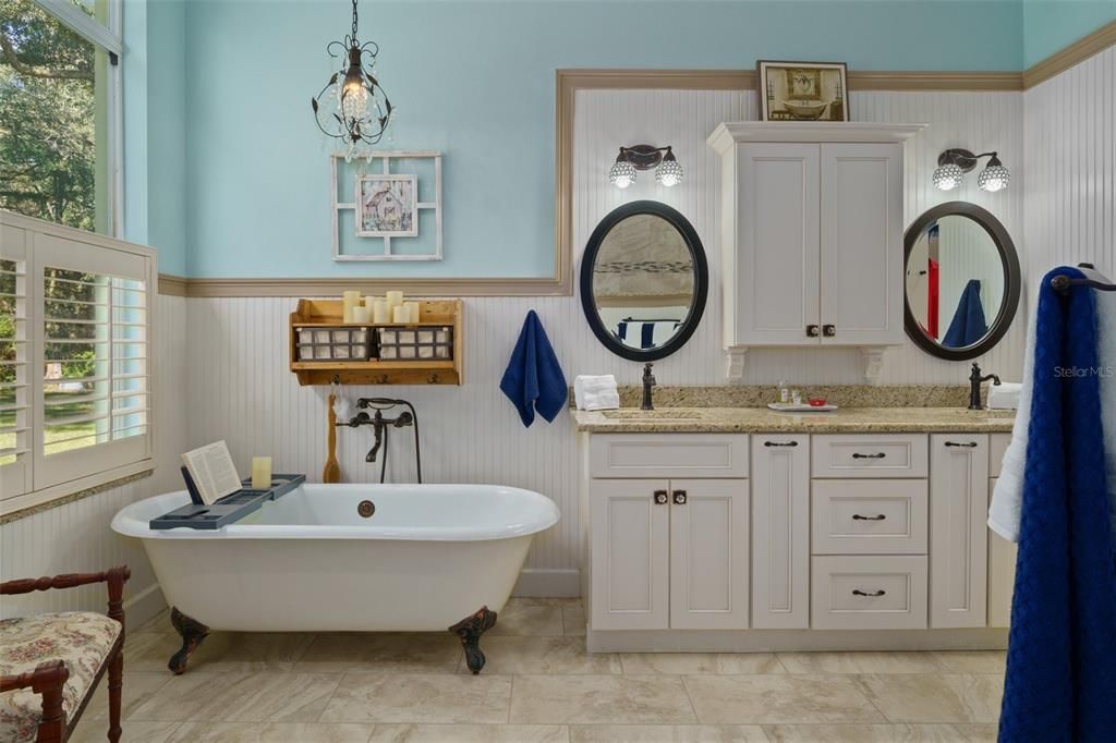 Remodeled bath with Clawfoot tub and separate shower. Granite counters & double vanities