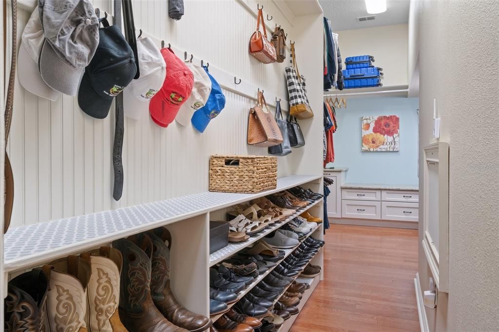 Long closet with tons of storage for shoes and clothes.