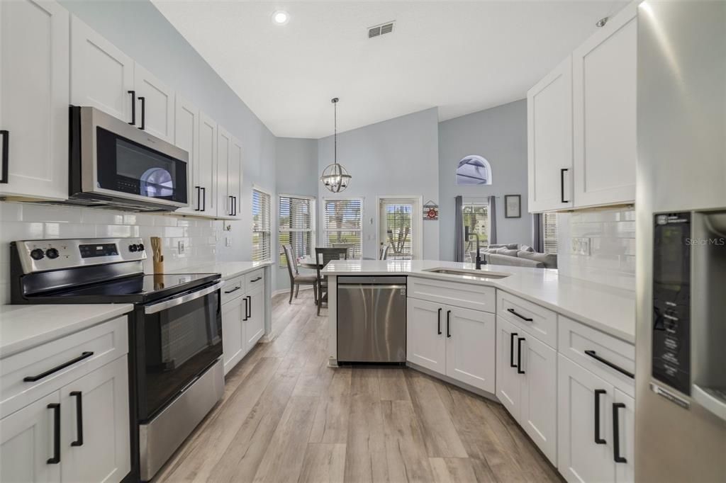 The home chef will be delighted to learn this 2024 kitchen renovation included modern SHAKER STYLE CABINETRY, QUARTZ COUNTERS, TILED BACKSPLASH and the STAINLESS STEEL APPLIANCES have been updated in recent years.