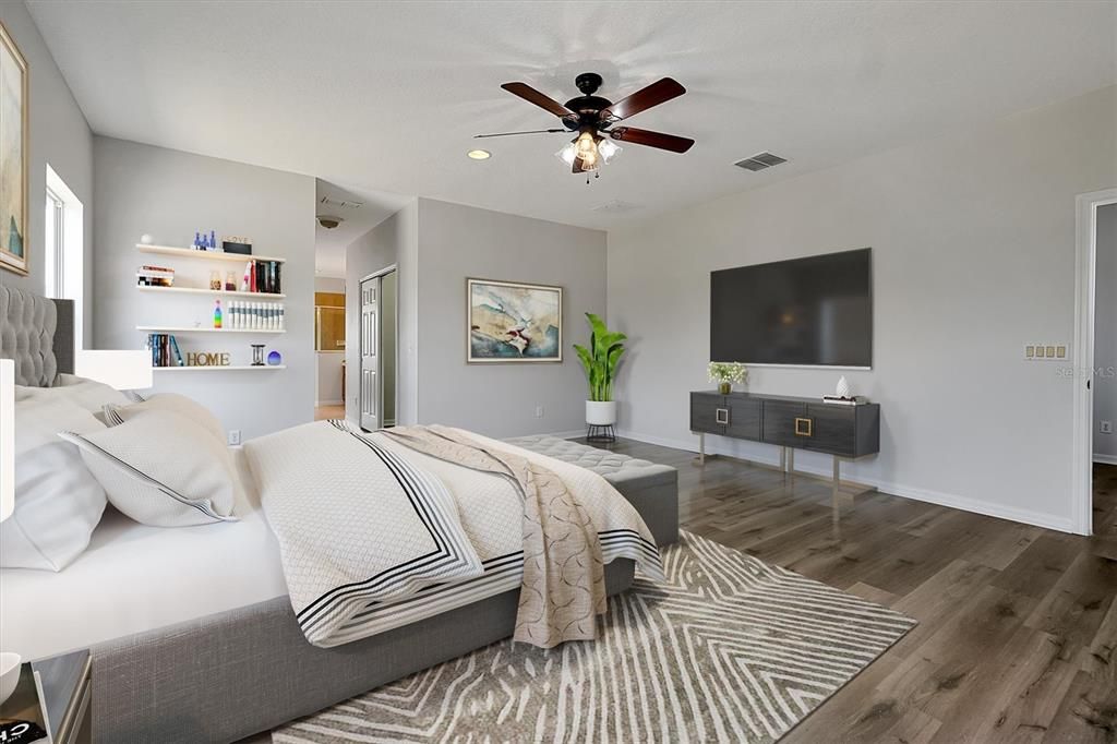 Master bedroom is spacious with luxury vinyl flooring and freshly painted walls and trim