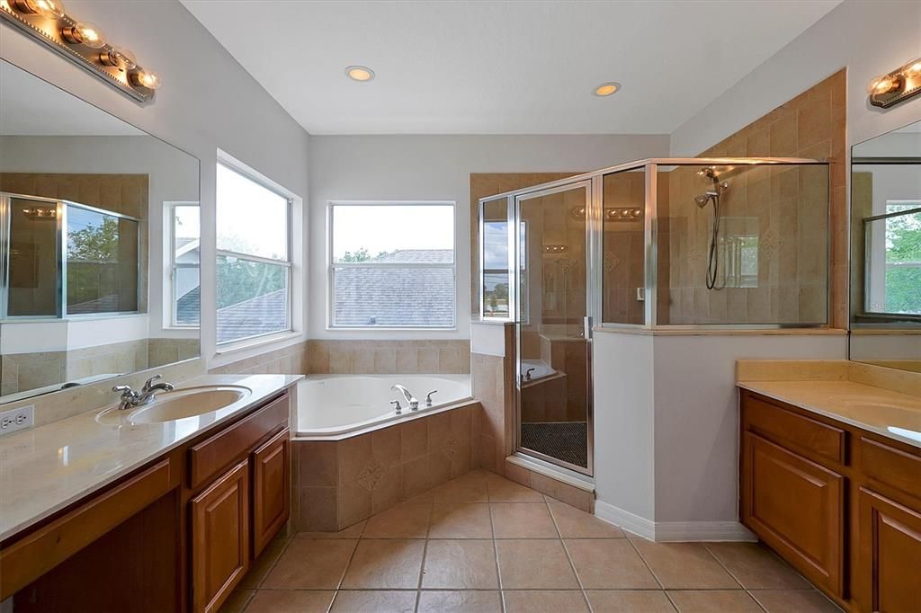 Master bathroom is spacious with soaking tub, walk in shower and his and hers vanities.