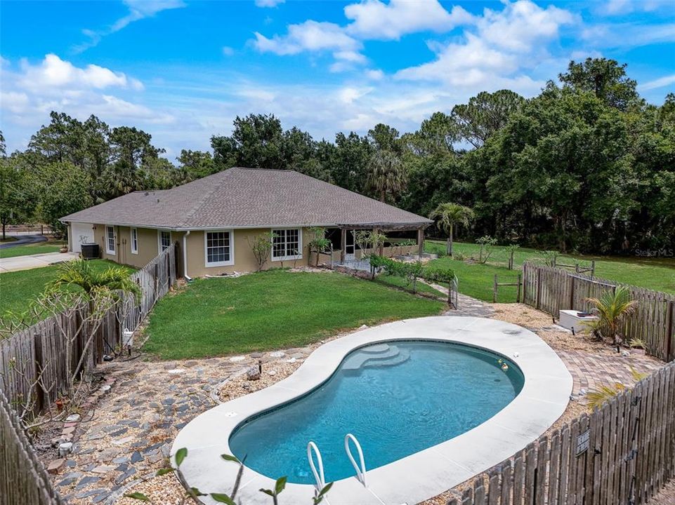 The pool area is fenced, the yard is landscaped and there is NO HOA so bring your BOAT or RV!
