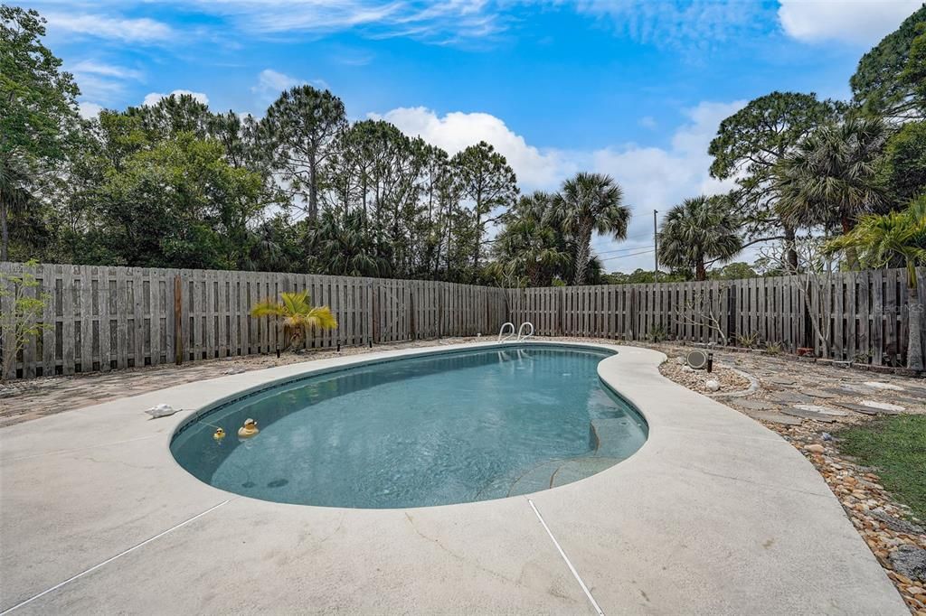 The pool area is fenced, the yard is landscaped and there is NO HOA so bring your BOAT or RV!