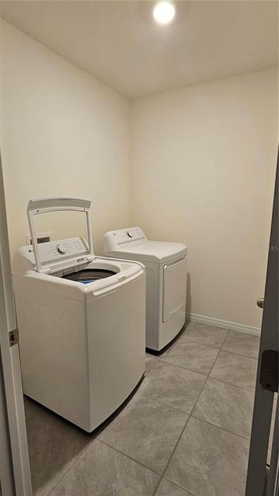 Laundry room with tile floors