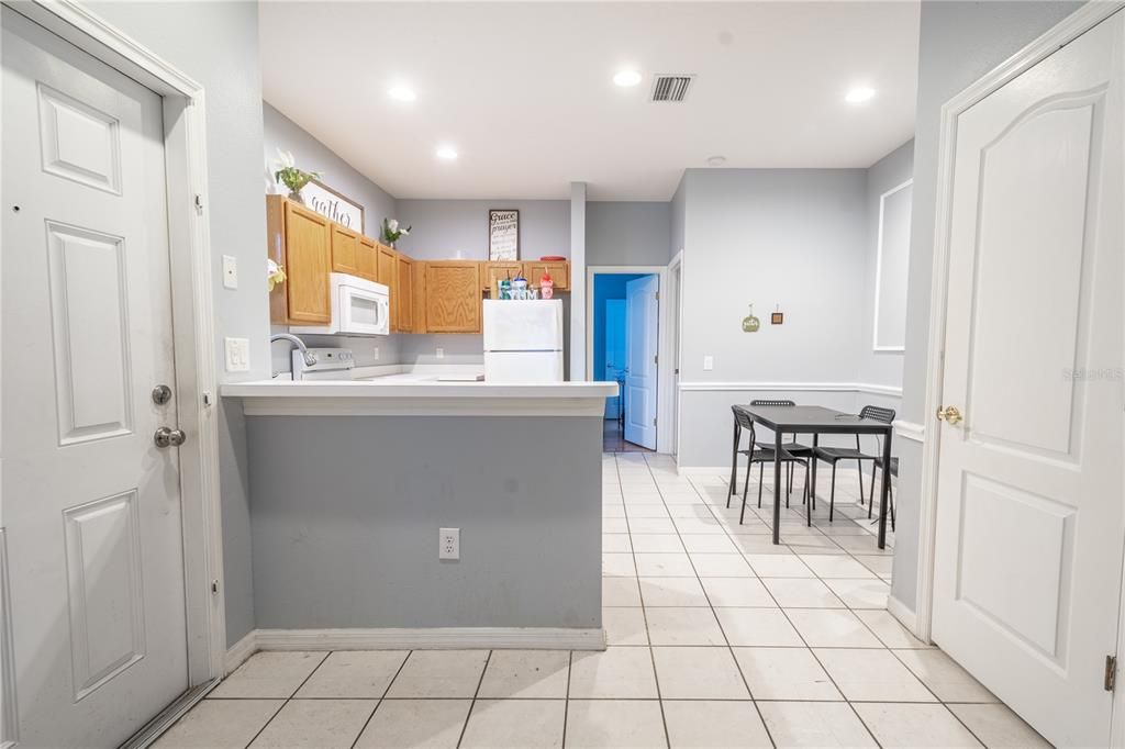 The kitchen features a small breakfast bar.