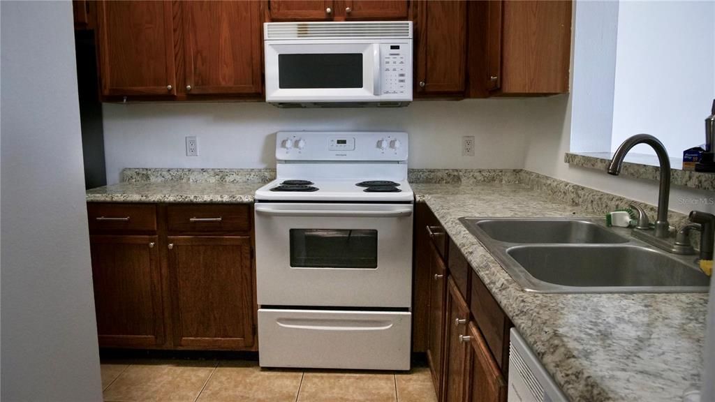 Comfy kitchen with the sink overlooking the dining room