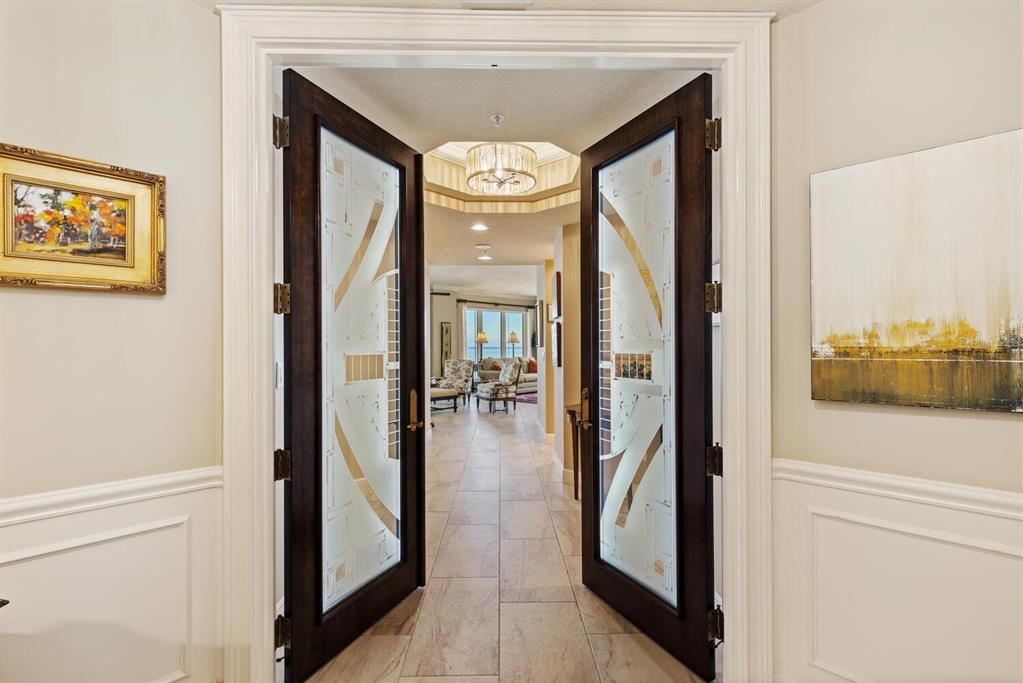 Designer Glass Entry Door from Elevator Lobby