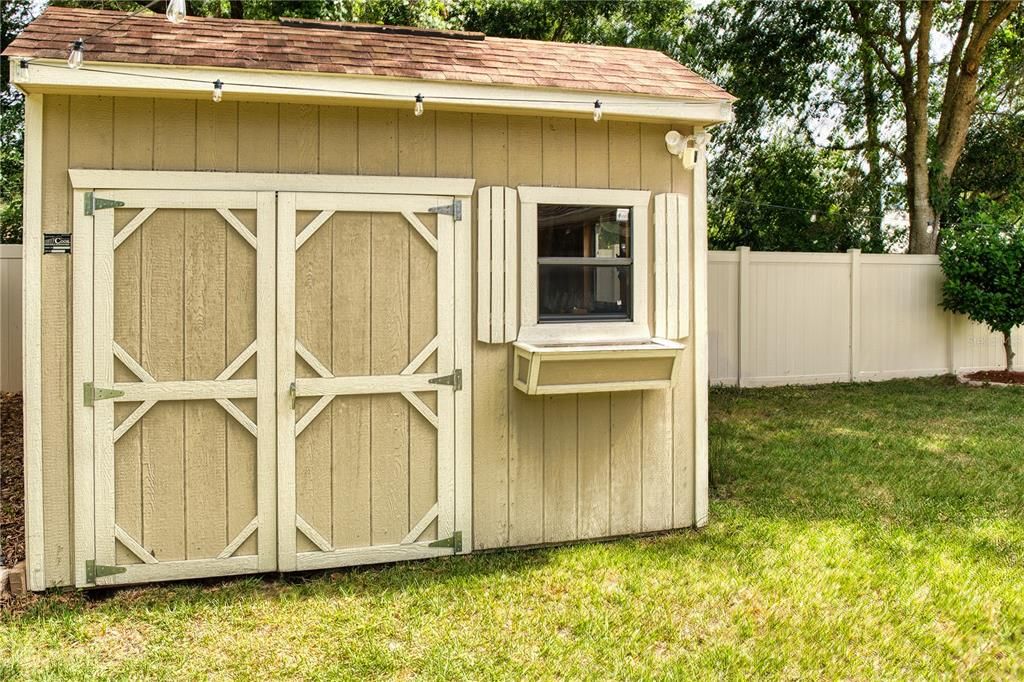 Included are three sheds, one of which is equipped with electricity and comes with a workbench, offering versatility as a workshop, she shed, or additional storage space.