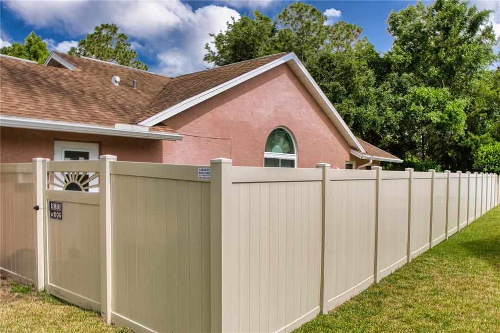 This property features a completely vinyl-fenced yard, providing privacy, security, and a clean, attractive boundary around the home