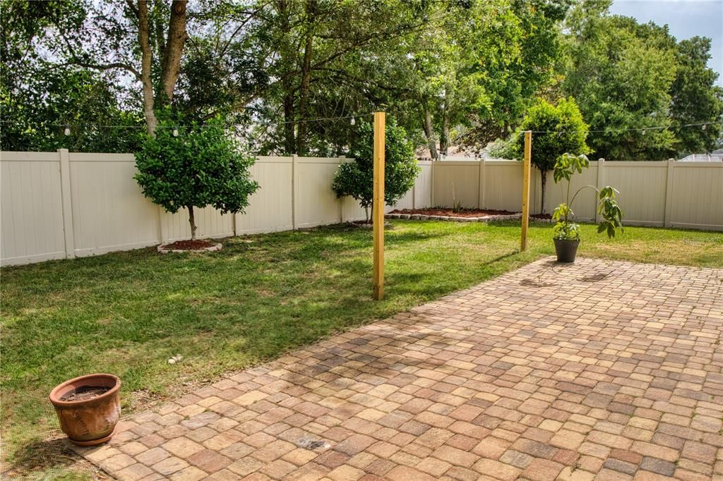 In addition to the covered and screened lanai, this home features an open patio with decorative pavers, perfect for sunning, barbecuing, and other outdoor activities.