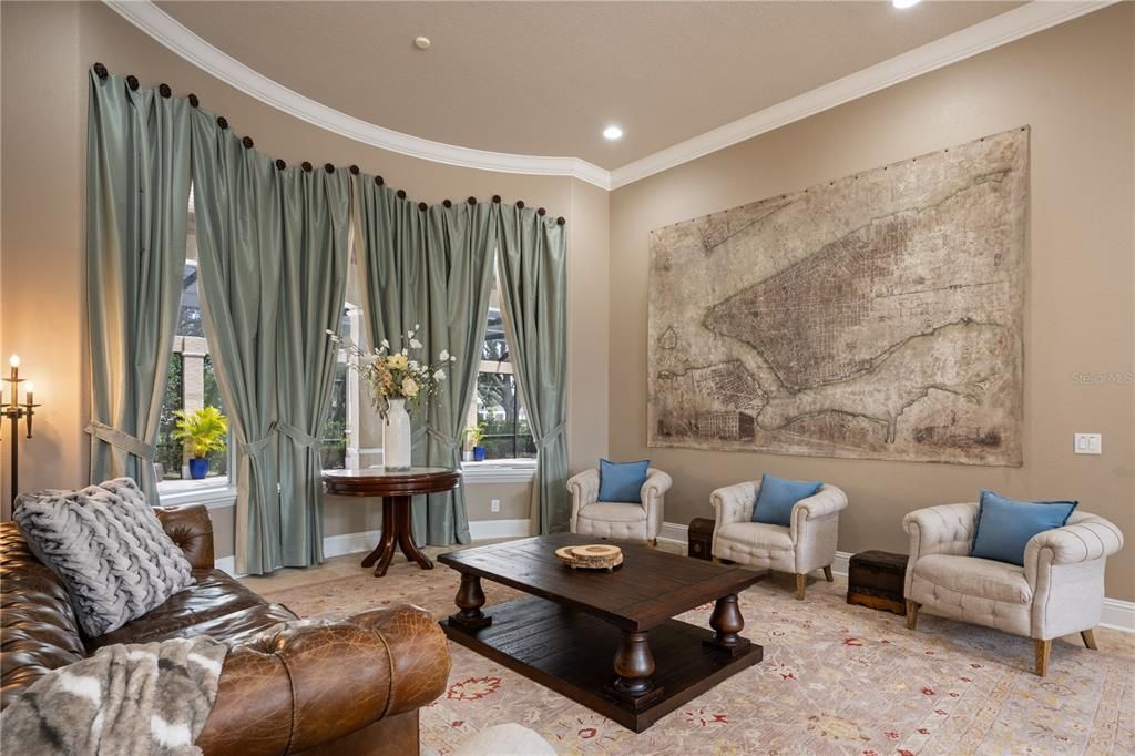 Formal Living Room greets you with soaring ceilings