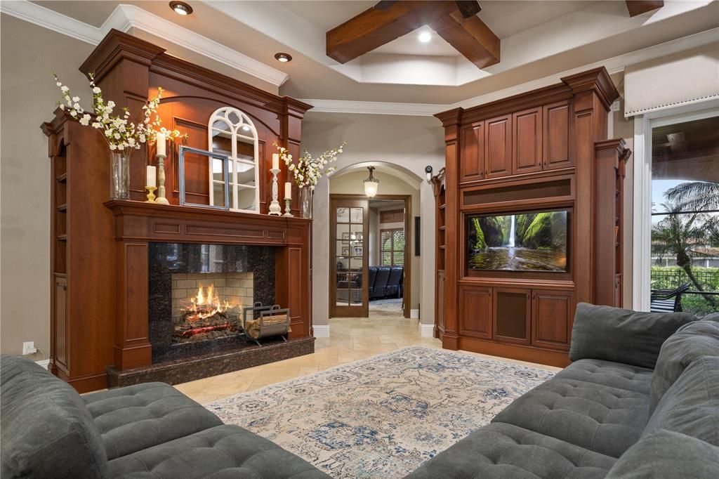 Family Room has warm wood accents and sets the tone for the adjacent Game/Media Room.