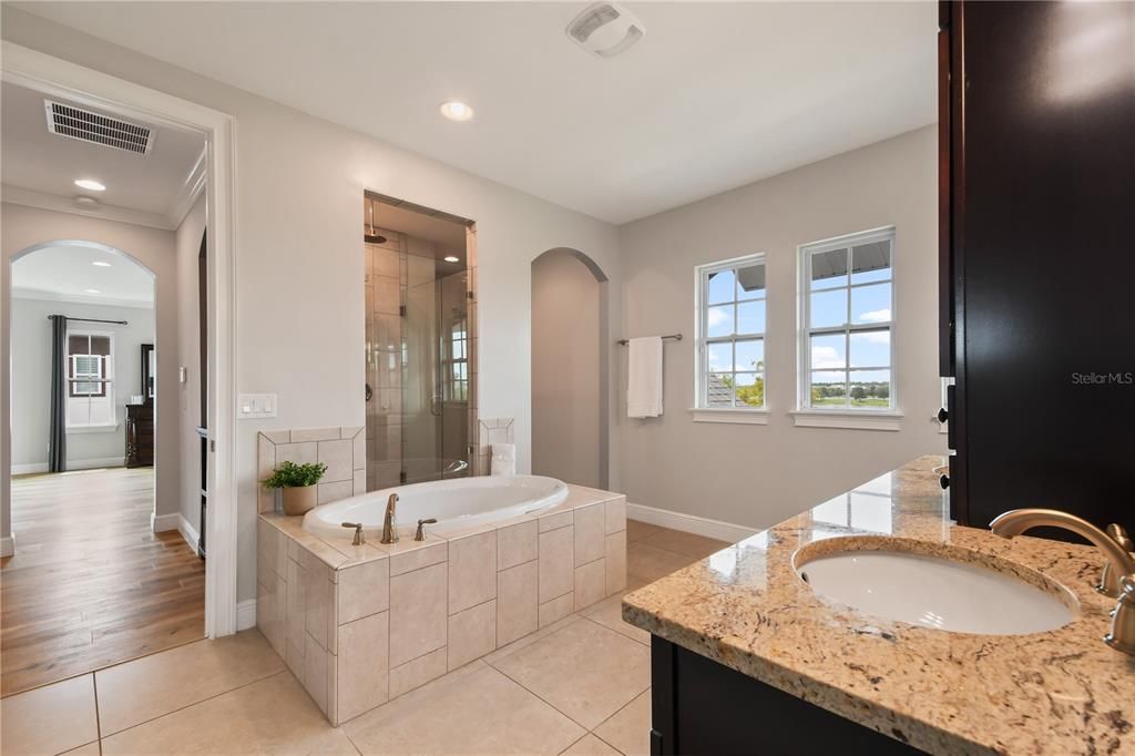 Double Sinks, Soaking Tub, and Shower with Private Toilet Room