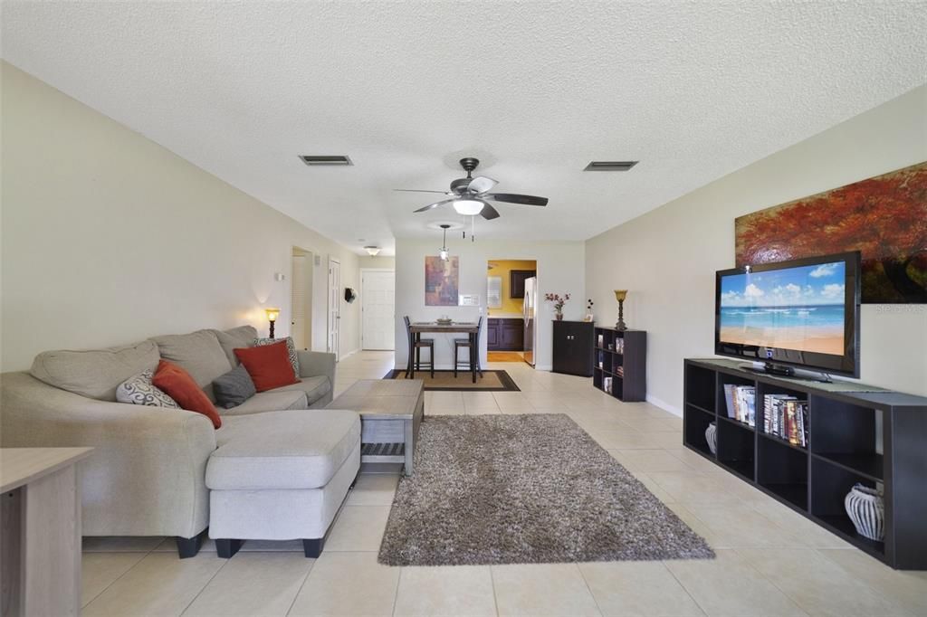 The new owner will enjoy a bright OPEN LIVING SPACE, two generous bedrooms (one being your primary suite!), easy care TILE FLOORS in the main living areas...