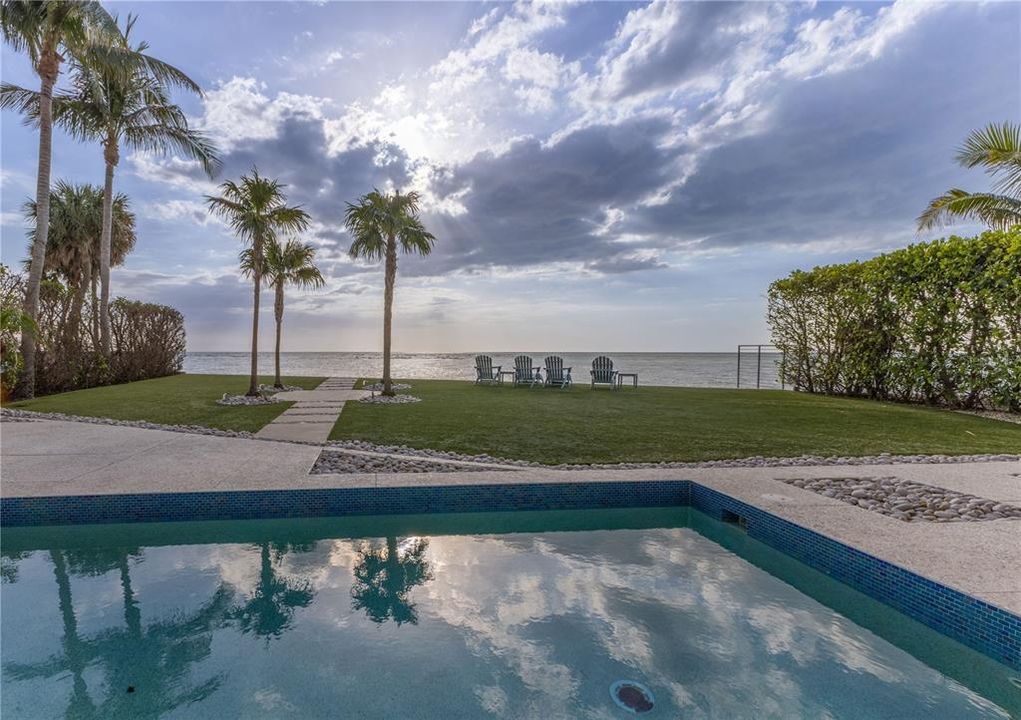 Open ocean view with pool spa large yard and seawall