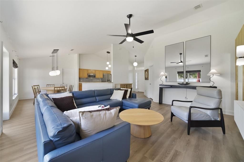 The LVP floors throughout, HIGH CEILINGS and OPEN CONCEPT living and dining add to the light and bright feel and there is modern kitchen at the heart of it all.
