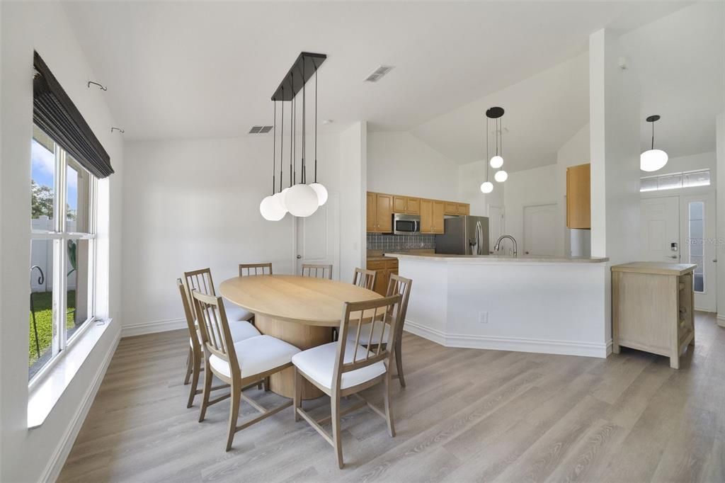 The family chef will appreciate the STAINLESS STEEL APPLIANCES (the range is new 2024 and fridge was replaced in 2023!), ample storage and counter space plus a breakfast bar for additional casual dining or perfect for entertaining family and friends.