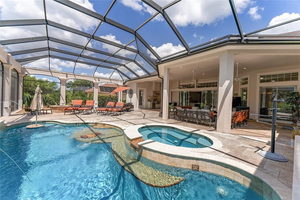 Another view of POOL & SPA shows IN-POOL granite table top w/ umbrella feature (left) and the BAJA SHELF.