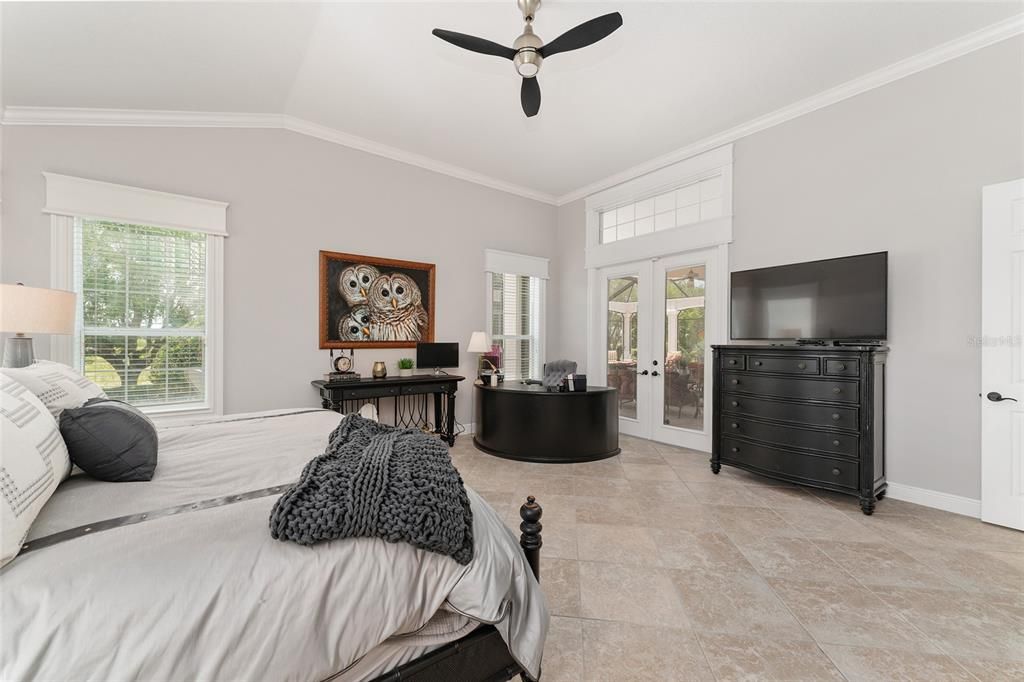 Another view of PRIMARY BEDROOM shows DOUBLE FRENCH DOORS w/ BUILT IN BLINDS leading to the LANAI.