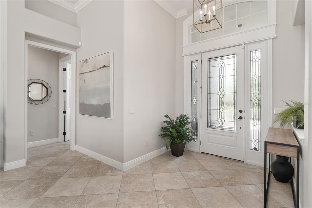 Moving toward the GUEST WING, a HALLWAY (left) is located just off the FOYER.