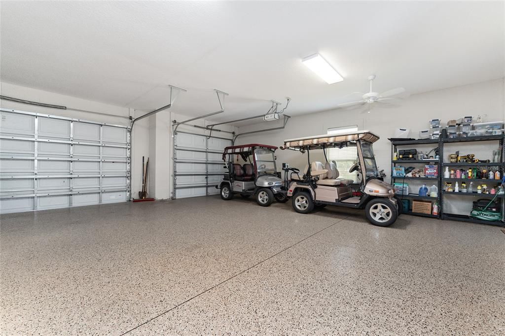 EXTENDED 3 CAR GARAGE with ~1200 SF, featuring EPOXY garage floor finish, two ceiling fans, and plenty of room for tandem parking for two golf carts!