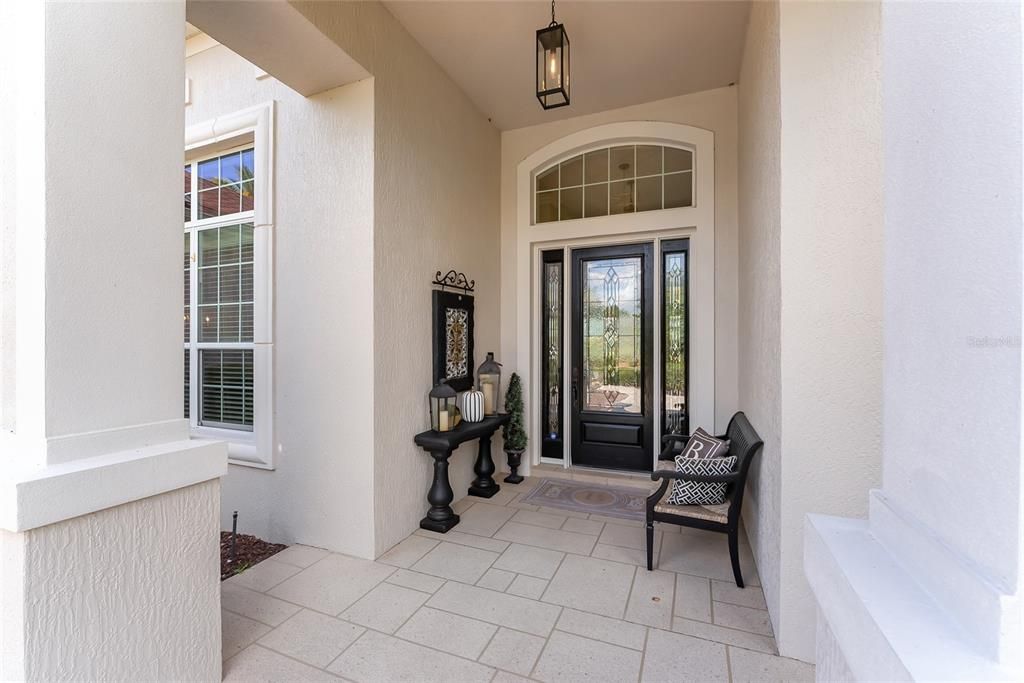 Welcoming FRONT DOOR with overhead TRANSOM window, 3/4 length LEADED GLASS INSERT w/ matching side lites.