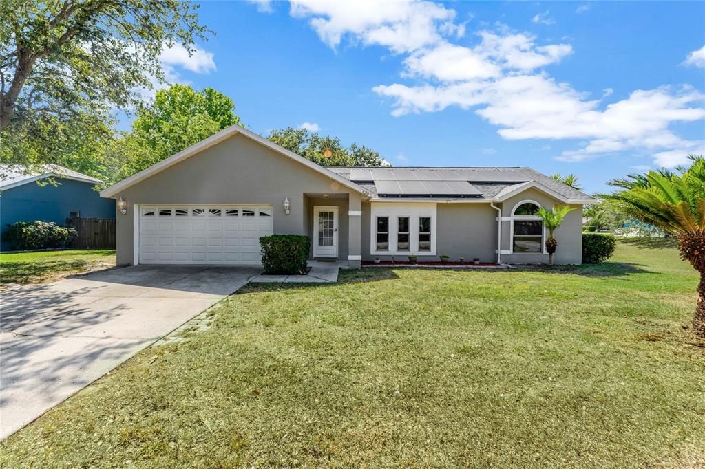 Welcome to Lakewood Ridge in charming Minneola and this 4-bedroom, 2-bath home with an UPDATED ROOF (2017), A/C (2015), WATER HEATER (2017) and ALL NEW DOUBLE PANE WINDOWS (2022)!