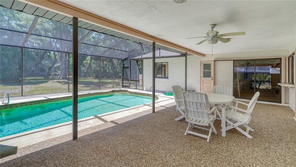 Large shaded rear lanai has plenty of room for pool lounges, an outdoor dining set and additonal seating, if needed.