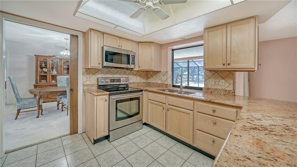 Kitchen features granite counters and stainless applicances.