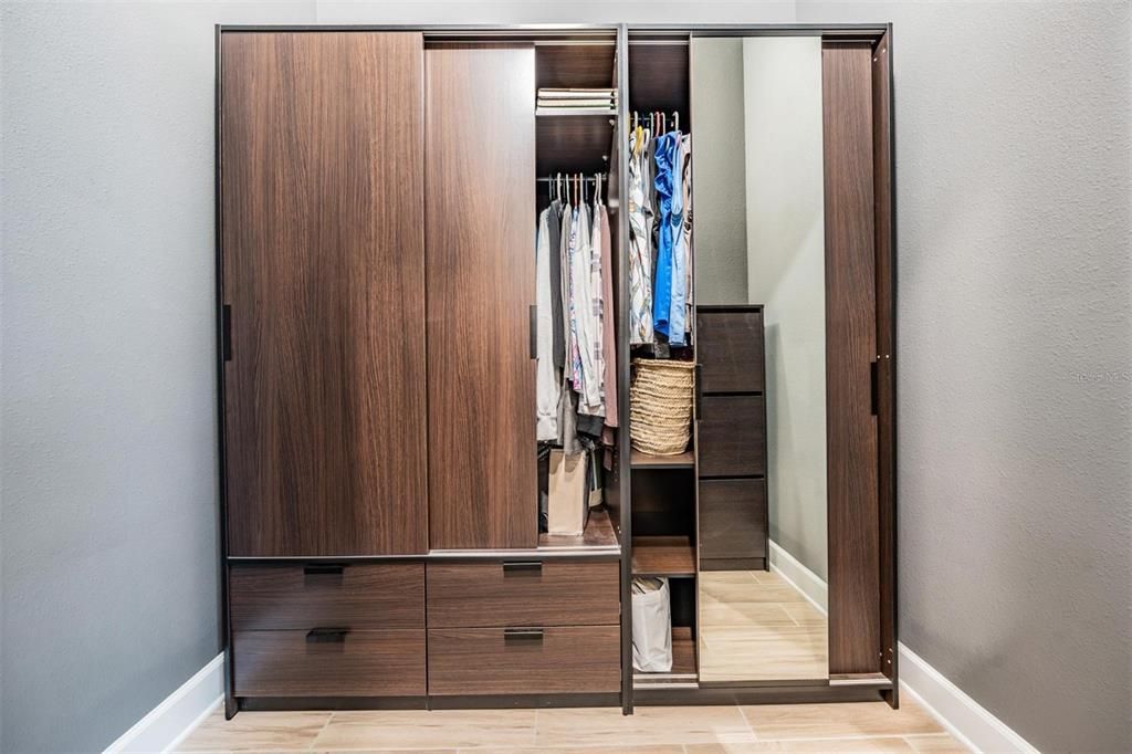 Primary closet 1, with cabinet shelving