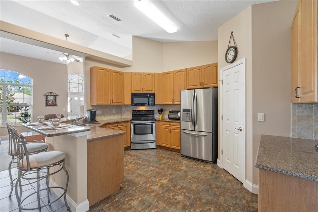 Kitchen: view 2 Large walk in pantry, tile flooring stainless steel appliances