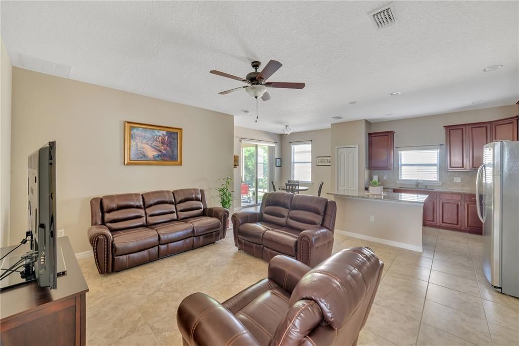 OPEN CONCEPT INCLUDES WELL EQUIPPED KITCHEN AND DINETTE.