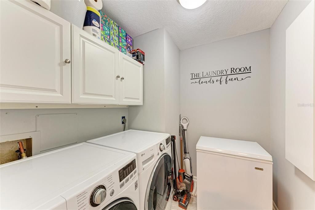 Centrally located laundry room with storage