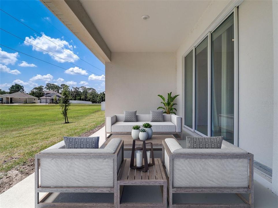 TRIPLE SLIDING GLASS DOORS give you access to a COVERED LANAI and the perfect place to host weekend cookouts! Virtually Staged.