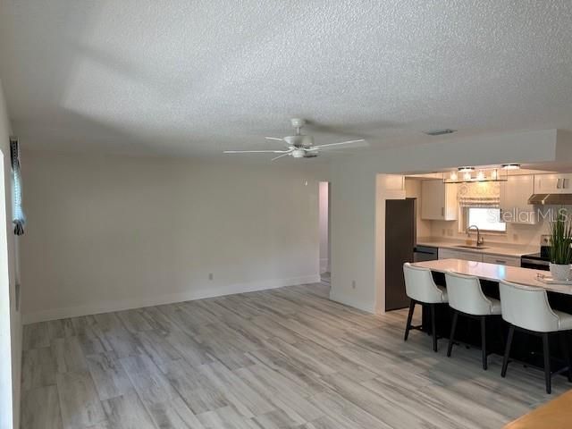 LARGE GREAT ROOM WITH TILE FLOORING
